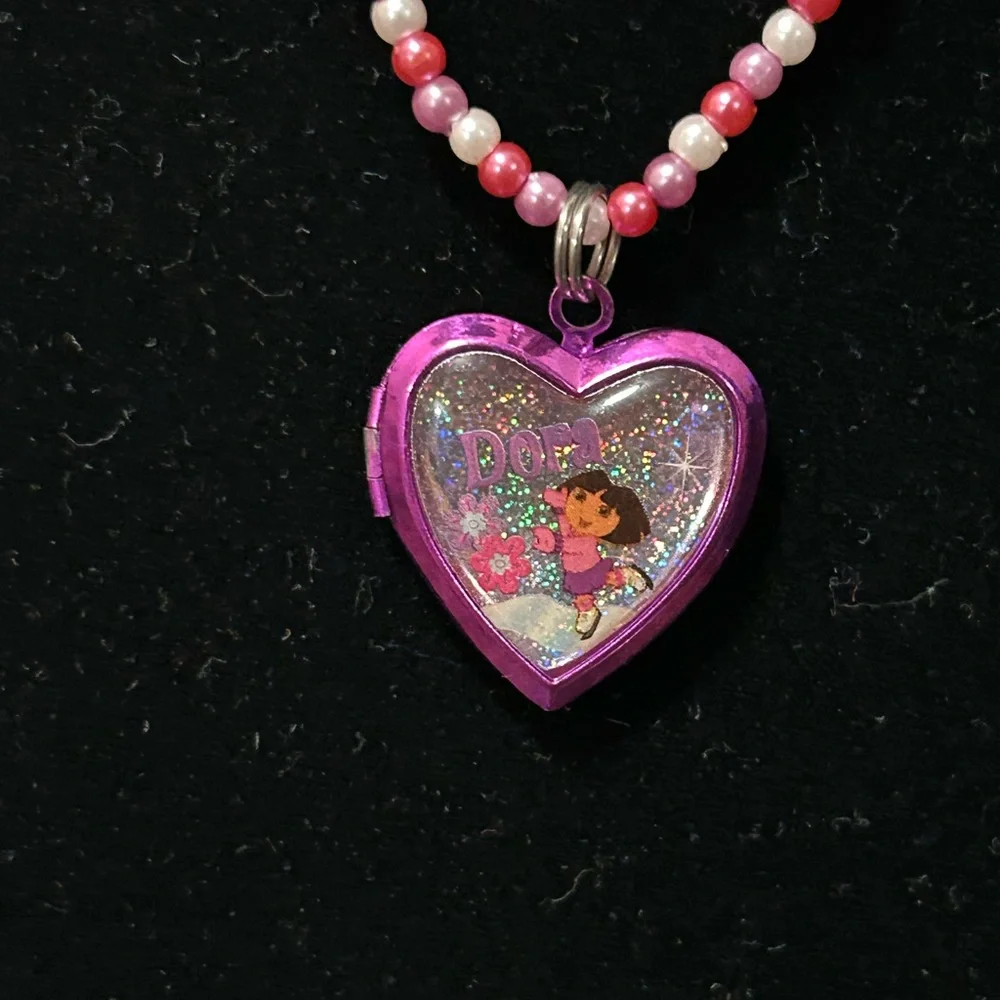Pink and white beaded necklace with Dora the Explorer locket